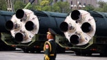 A member of the People's Liberation Army stands as the strategic strike group displays DF-5C nuclear missiles during a military parade to mark the 80th anniversary of the end of World War Two, in Beijing, China, September 3, 2025