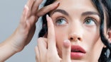 Young woman with contact lenses