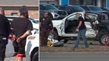 Singh Sukhdeep in handcuffs split with a destroyed Chevrolet truck on road after crash