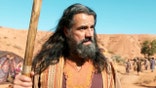Moses in the desert in "The Promised Land"
