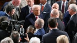 Trump greets lawmakers in the House chamber