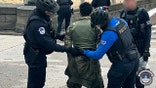 A man being arrested at the USCP