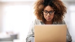 Woman Works on Laptop