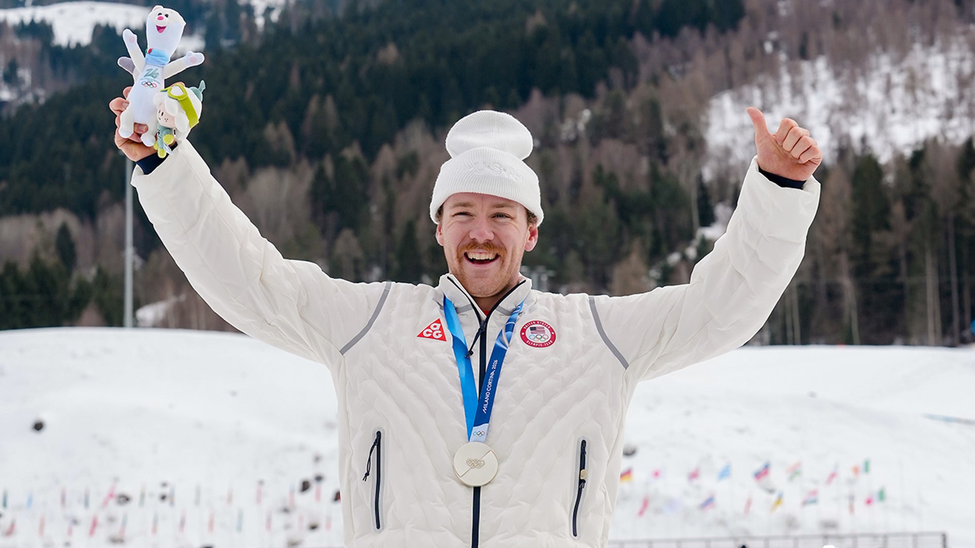 Ben Ogden poses with silver medal