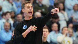 Duke staffers 'got punched in the face' as UNC fans stormed court after upset win, coach says