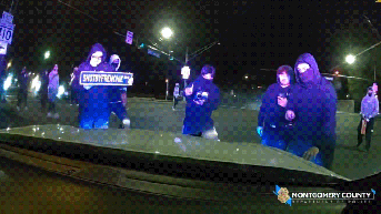 Wild video shows masked ruffians attacking police cruiser with officer inside during illegal street takeover - Fox News