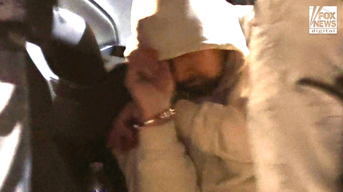 A man being detained by law enforcement following a traffic stop in Tucson, Arizona
