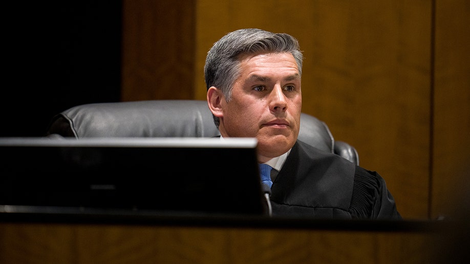 Judge Tony Graf seated at a bench in a courtroom.