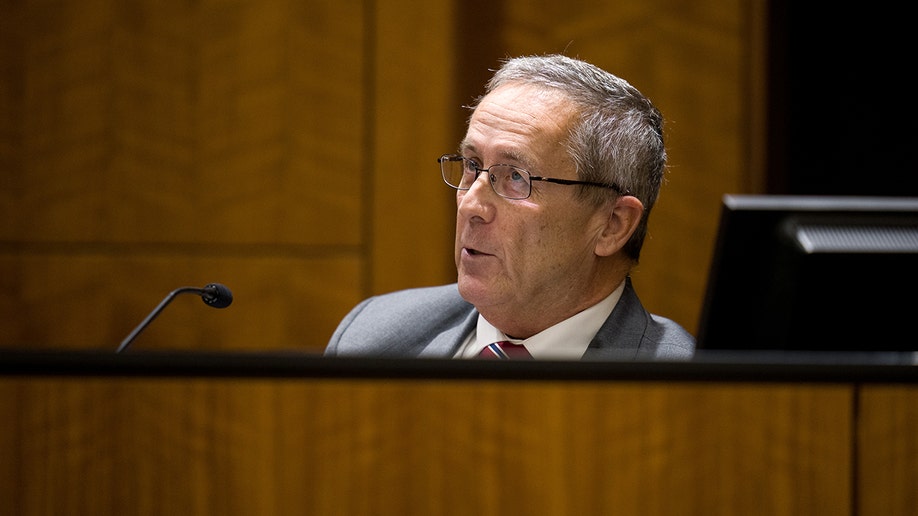 Jeff Gray standing at a podium in a courtroom.