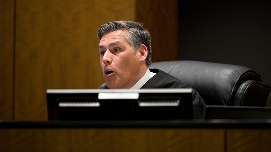 Judge Tony Graf seated at a bench in a courtroom.