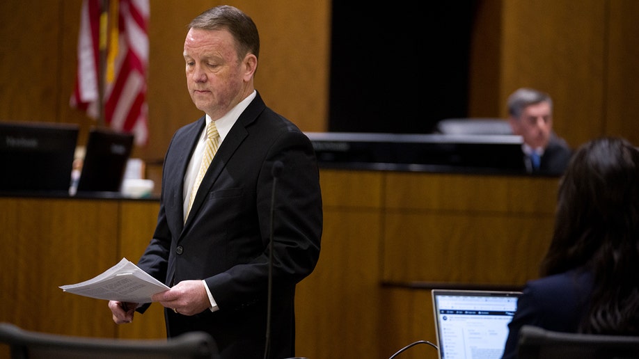 Christopher Ballard during a hearing in a courtroom.