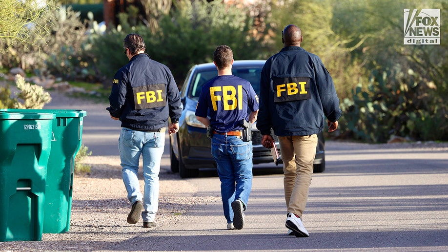 FBI agents canvassing a residential neighborhood near Nancy Guthrie's home