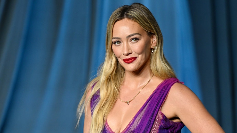 Hilary Duff flaunts figure in yellow swimsuit on girls' trip as 'toxic mom group' drama resurfaces