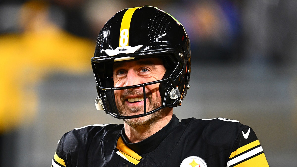 Aaron Rodgers looks on field