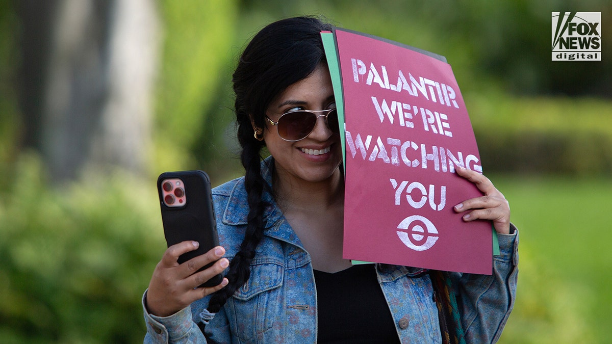 Activists gathered outside the Palantir headquarters in the Aventura area of Miami, Florida, during a demonstration.