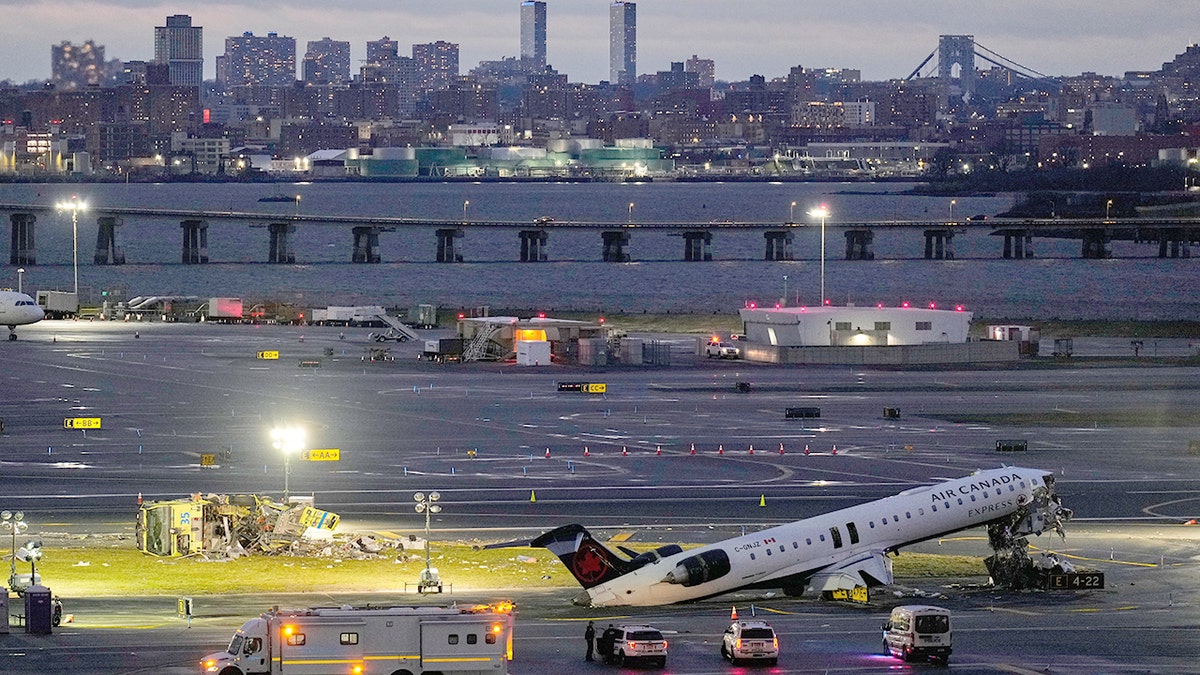 An Air Canada pitchy  with severed cockpit adjacent  to damaged Port Authority occurrence  motortruck  connected  LaGuardia Airport runway