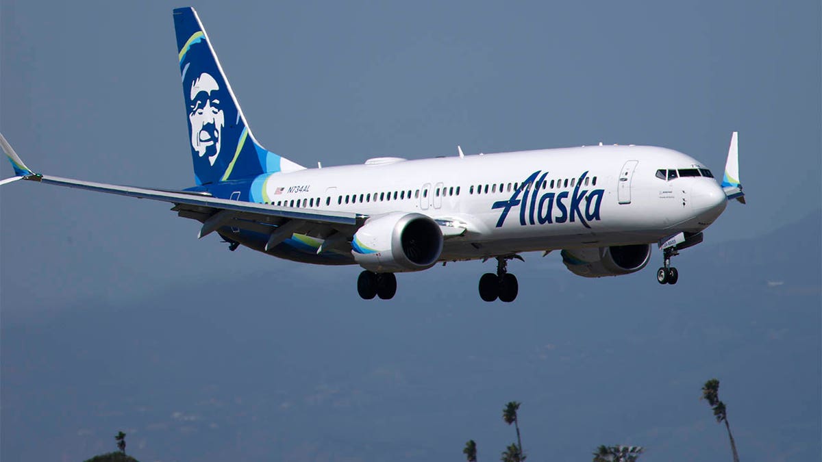 An Alaska Airlines plane flying 
