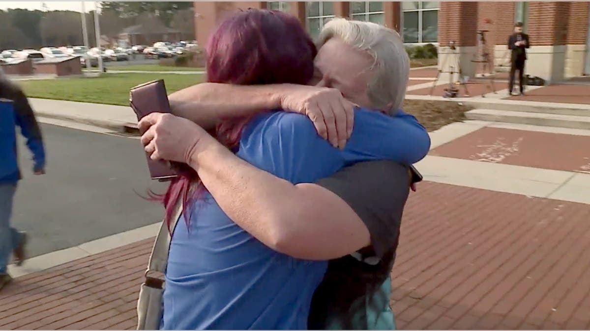 Michele Hundley embraces her daughter