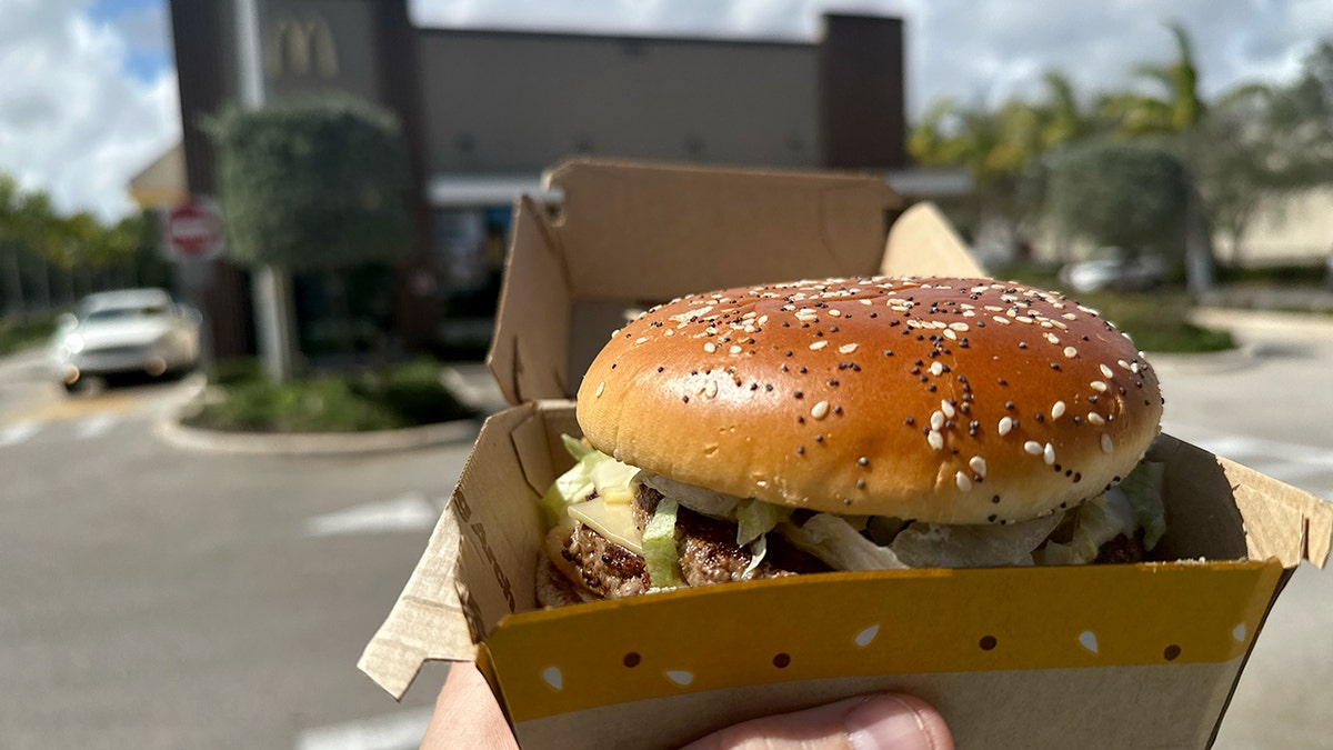 A Big Arch burger is shown outside of a McDonald's.