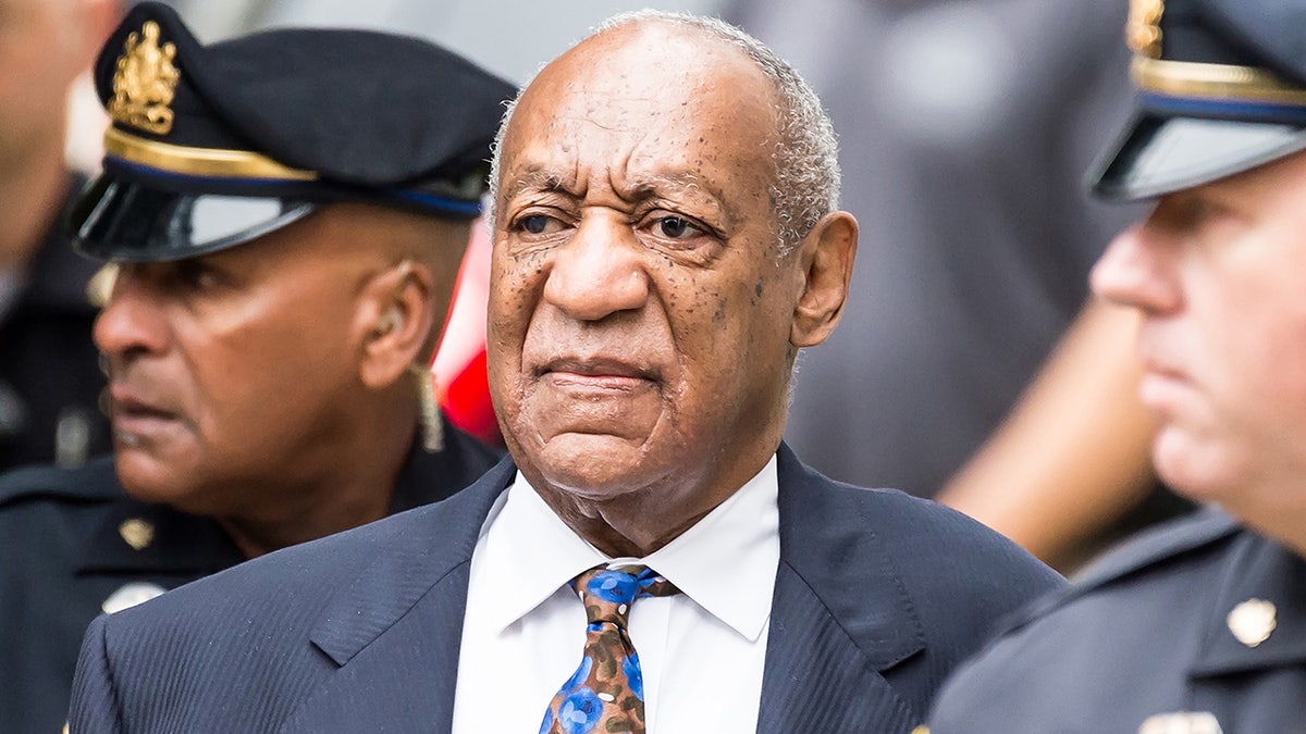 Bill Cosby leaves court trial wearing a suit.