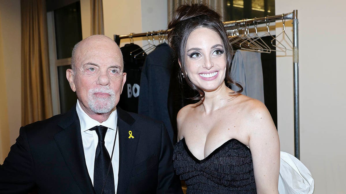 Billy Joel and Alexa Ray Joel pose together.