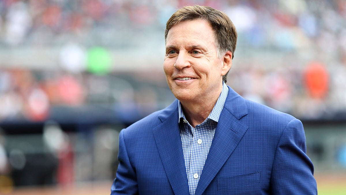 Sportscaster Bob Costas on the field before a game