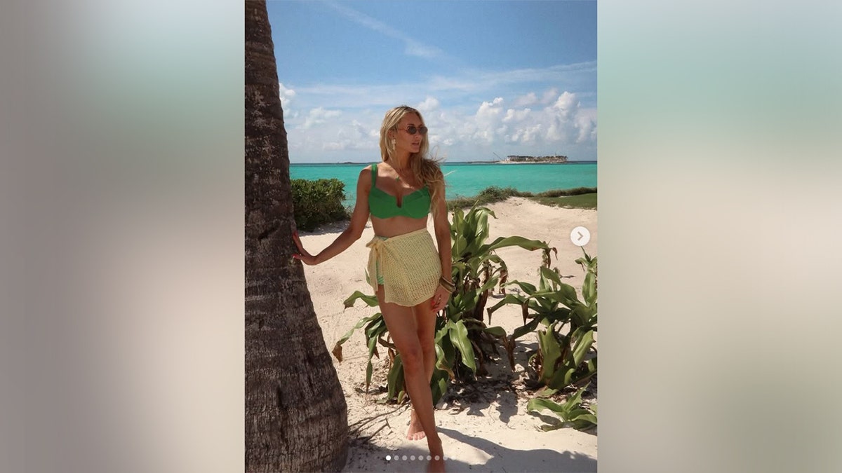 Brittany Aldean posing in green bikini during spring break beach vacation March 2026
