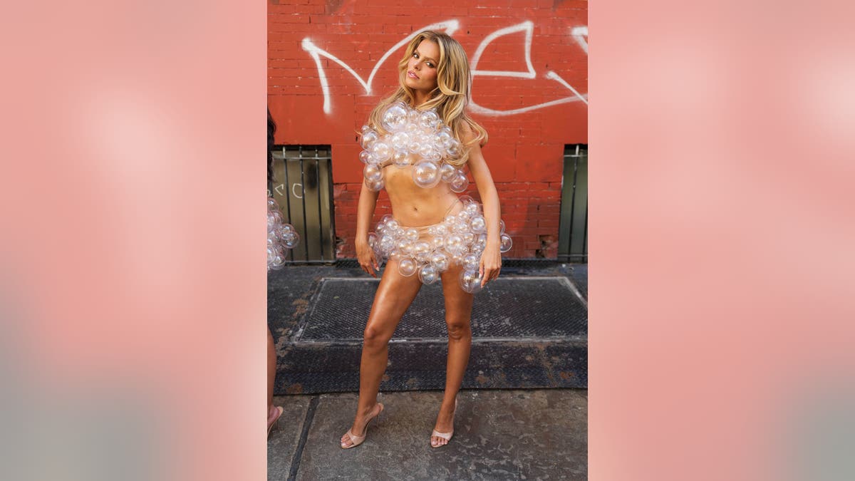 Brooks Nader poses in a bubble outfit