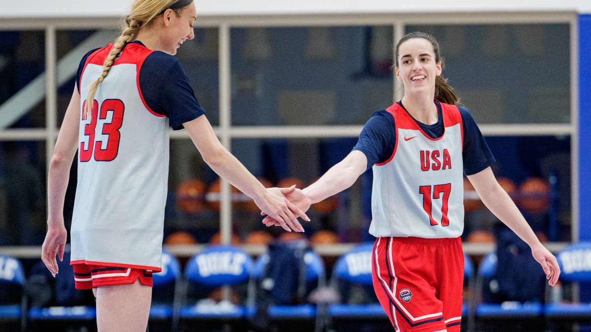 Cameron Brink shakes hands with Caitlin Clark 