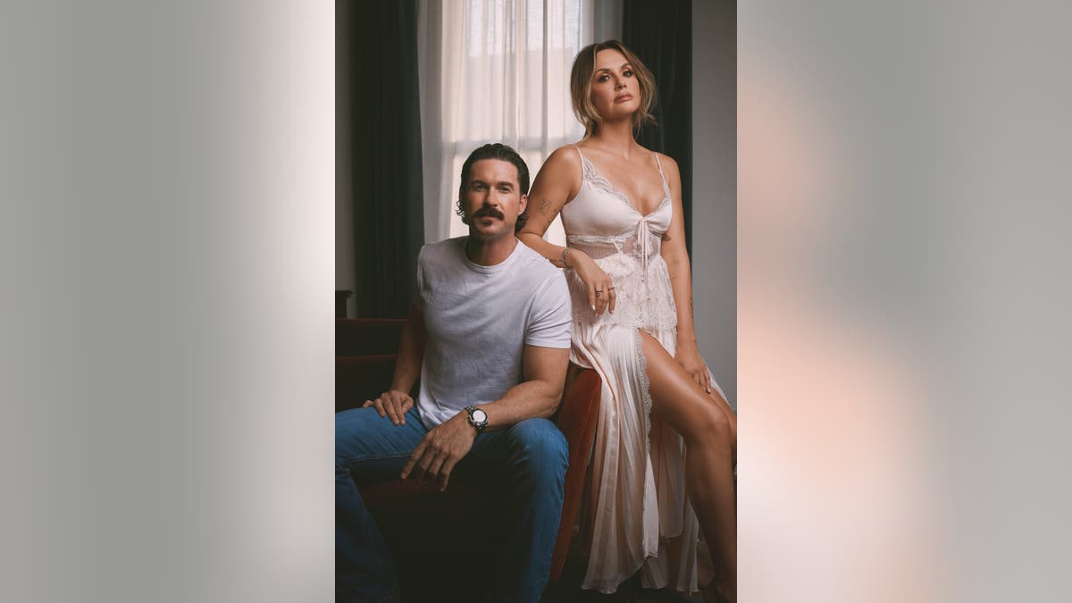 Carly Pearce and Riley Green posing