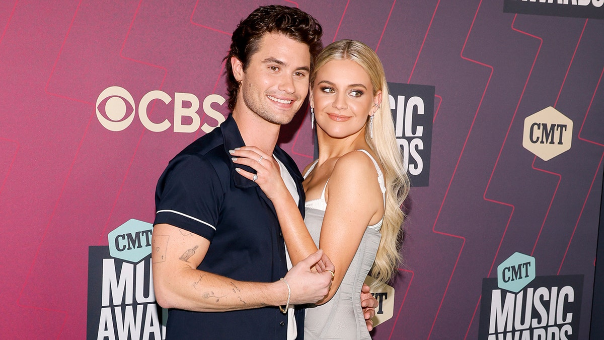 Chase Stokes and Kelsea Ballerini walking the red carpet at the CMT Awards in April 2023.