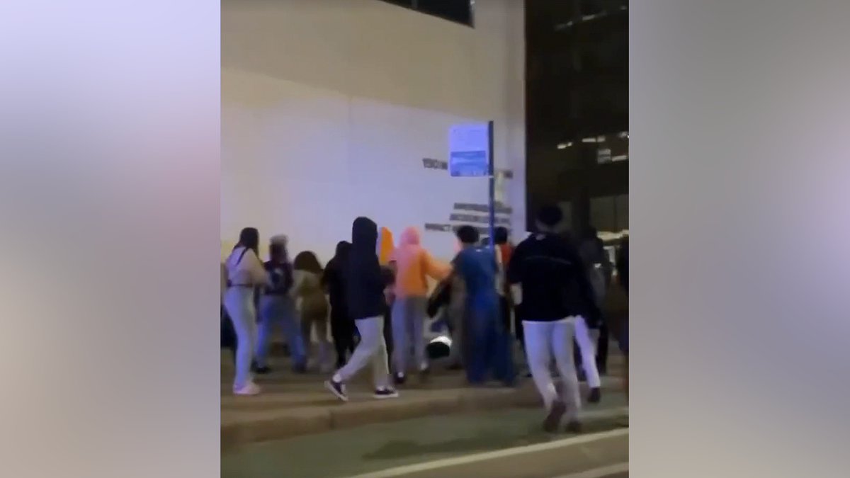 Group of teens gathered in downtown Chicago Loop during chaotic takeover near State and Lake