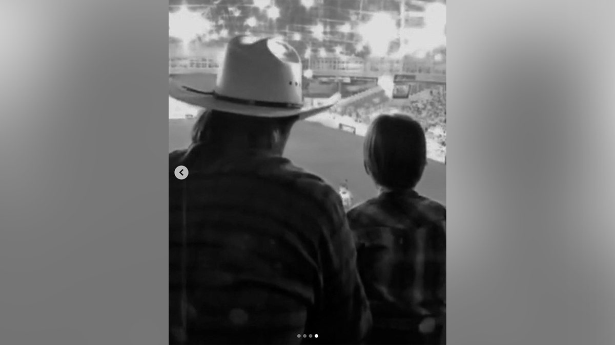 A photo of Chuck Norris and his son taken from behind.