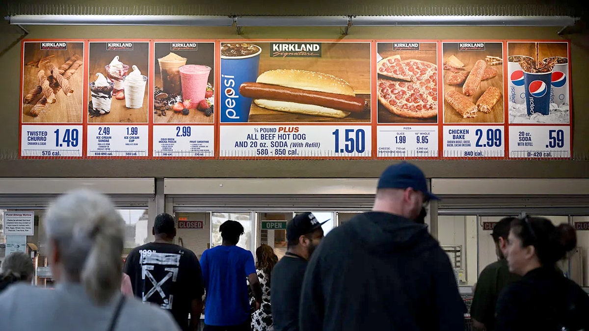 Costco shoppers wait in line at the food court, where the Twisted Churro appears on the menu.