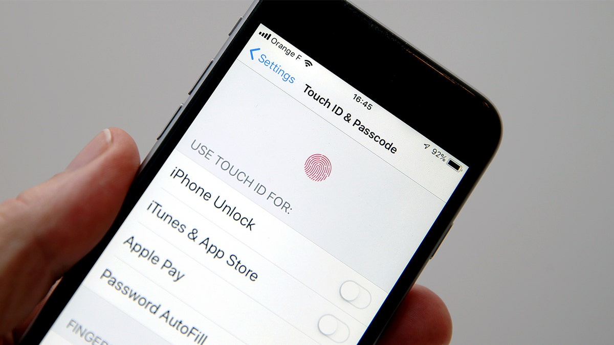 The iPhone "Touch ID & Passcode" settings page is shown on an iPhone screen.