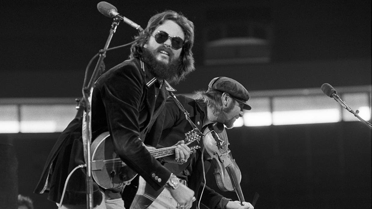 (L-R) Dash Crofts and Jimmy Seals perform at Georgia Tech's Alexander Coliseum on Oct. 22, 1977, in Atlanta, Georgia.