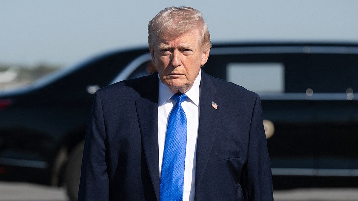President Donald Trump prepares to board Air Force One