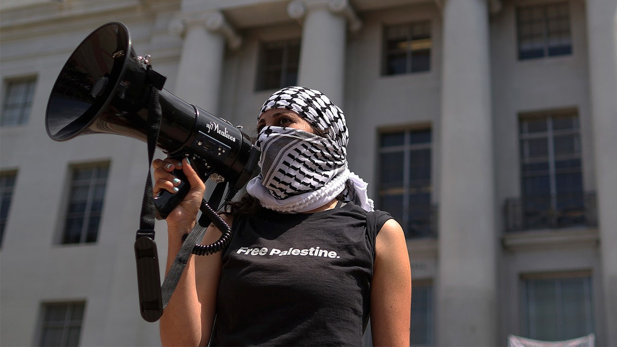Pro-Palestinian protester uses bullhorn at UC Berkeley.