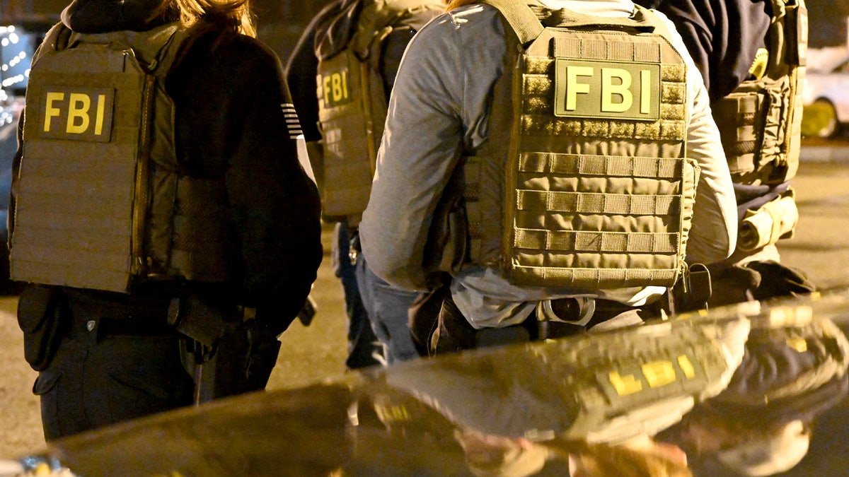 FBI agents wearing vests