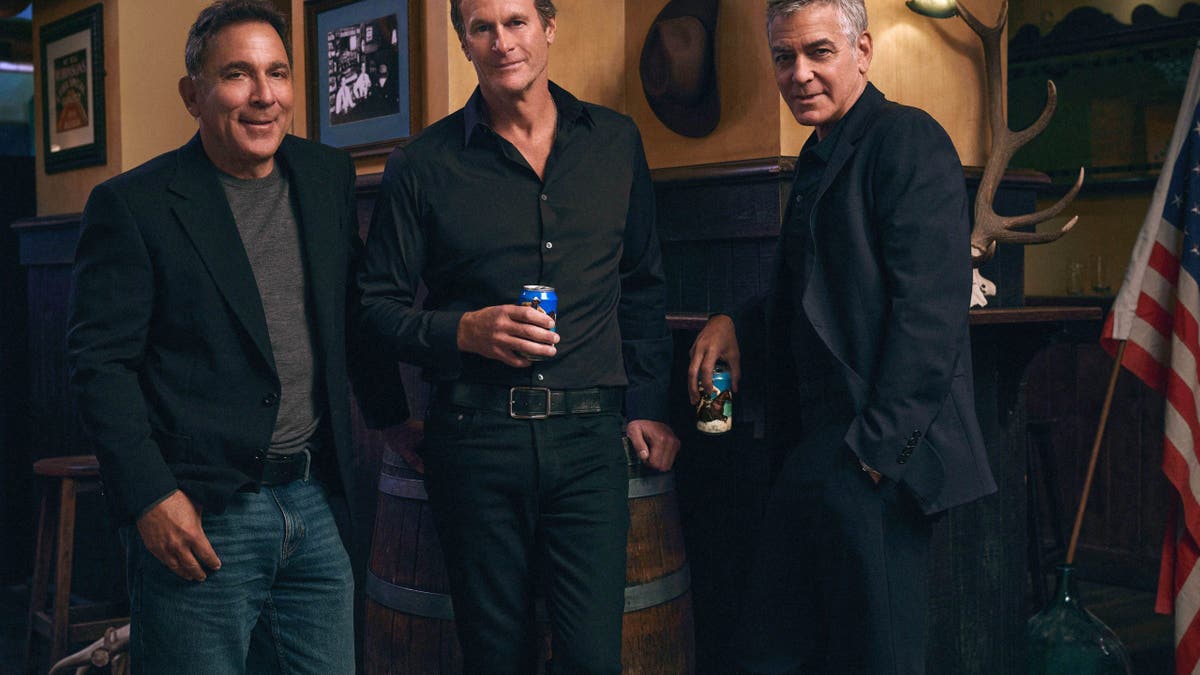 George Clooney, Mike Meldman and Rande Gerber posing with Crazy Mountain beer cans