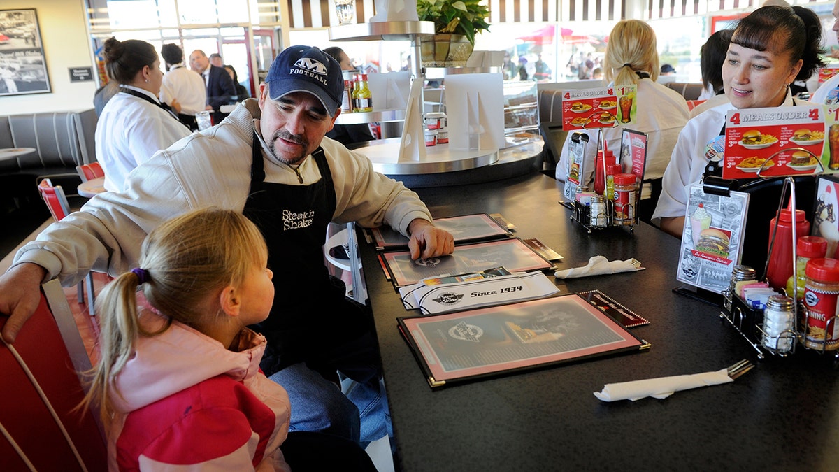 Dan Spindel asks his niece Daisy Dysart what she wants to order at Steak'n Shake