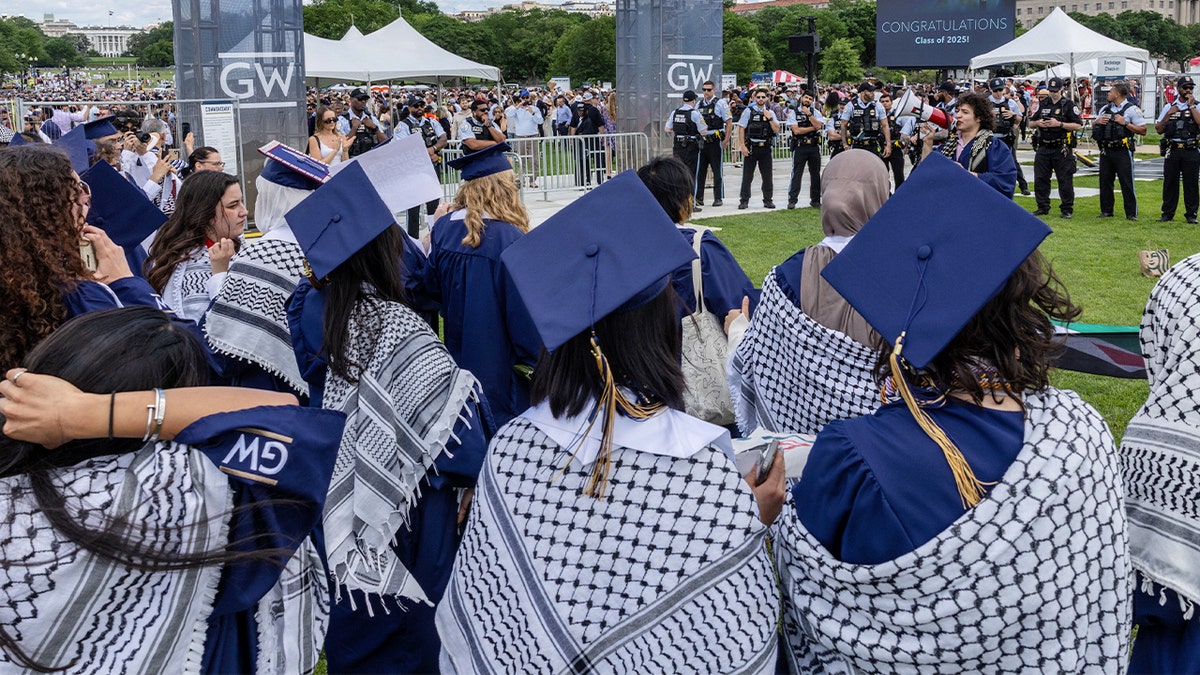 George Washington University graduates wearing traditional Palestinian keffiyehs