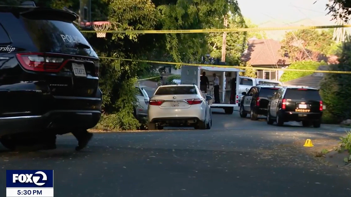 Police tape blocks off a quiet Lafayette neighborhood street following a reported homicide