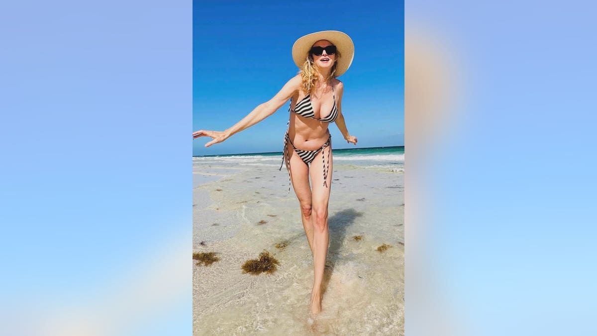 Heather Graham in a striped bikini