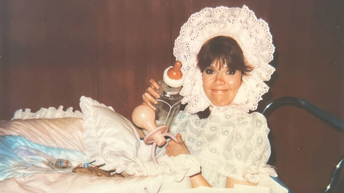 Holly Hallstrom in a baby costume.