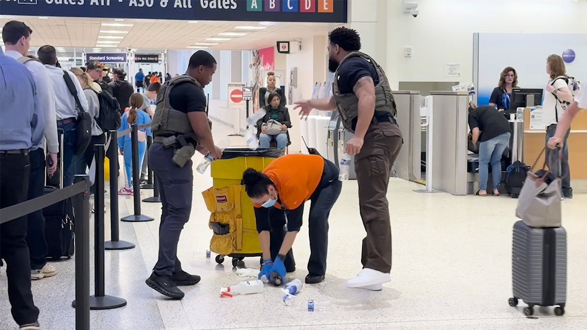 ICE agents picking up trash at airport