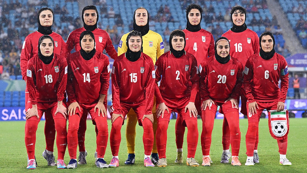 Iran players pose for a team photo