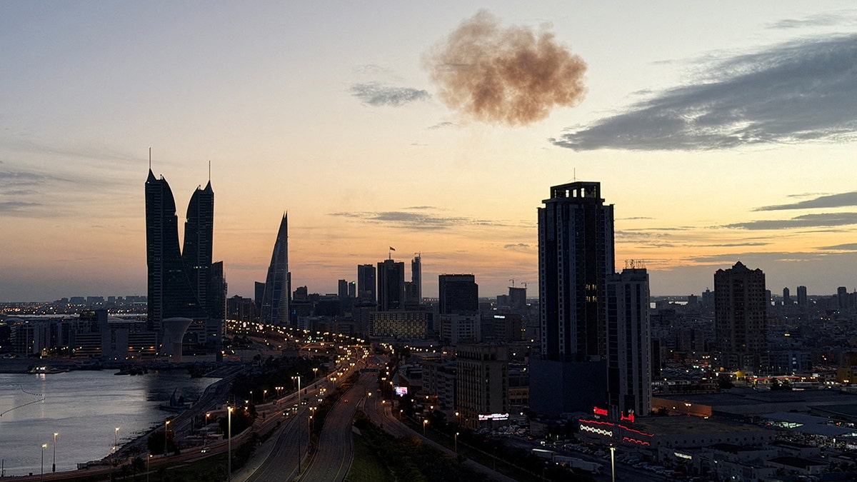 Smoke rising over the Bahrain Financial Harbour towers in Manama.