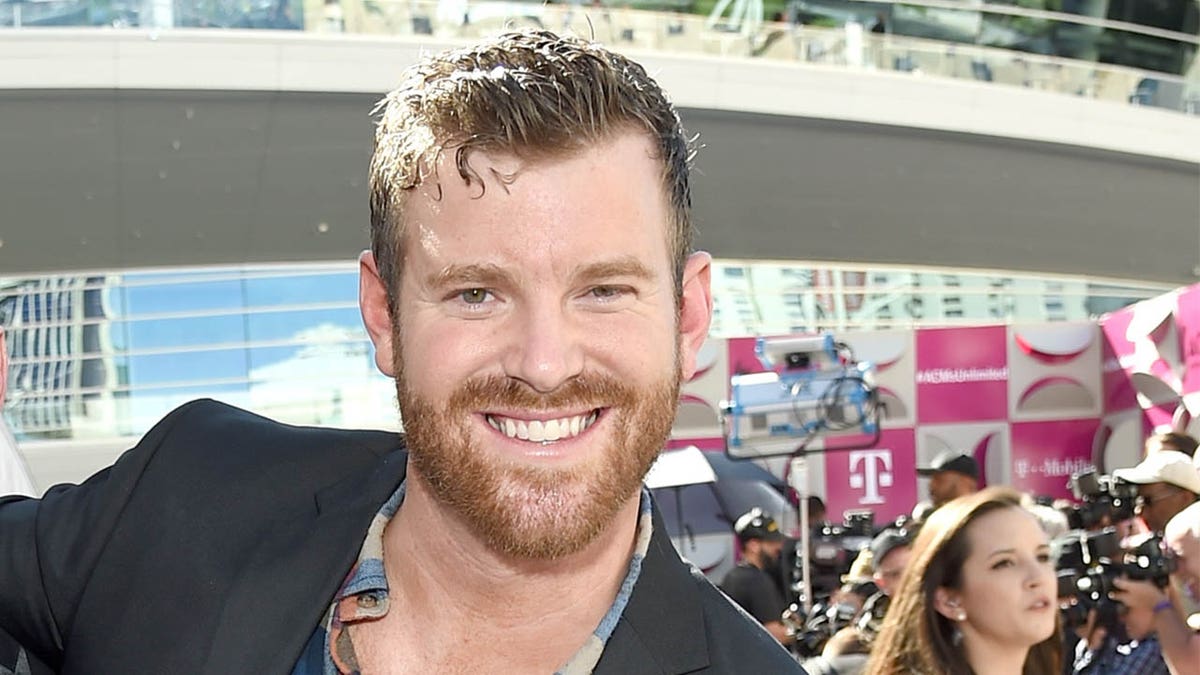 James McCoy Taylor smiling on red carpet