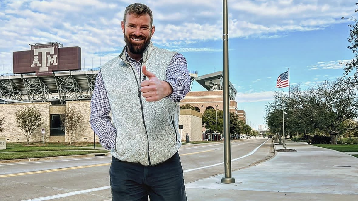 James McCoy Taylor flashing thumbs up sign